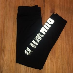 Black workout leggings with “run wild” print